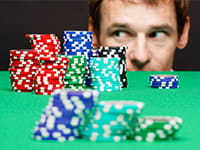 Different-sized stacks of chips - each player has a different budget